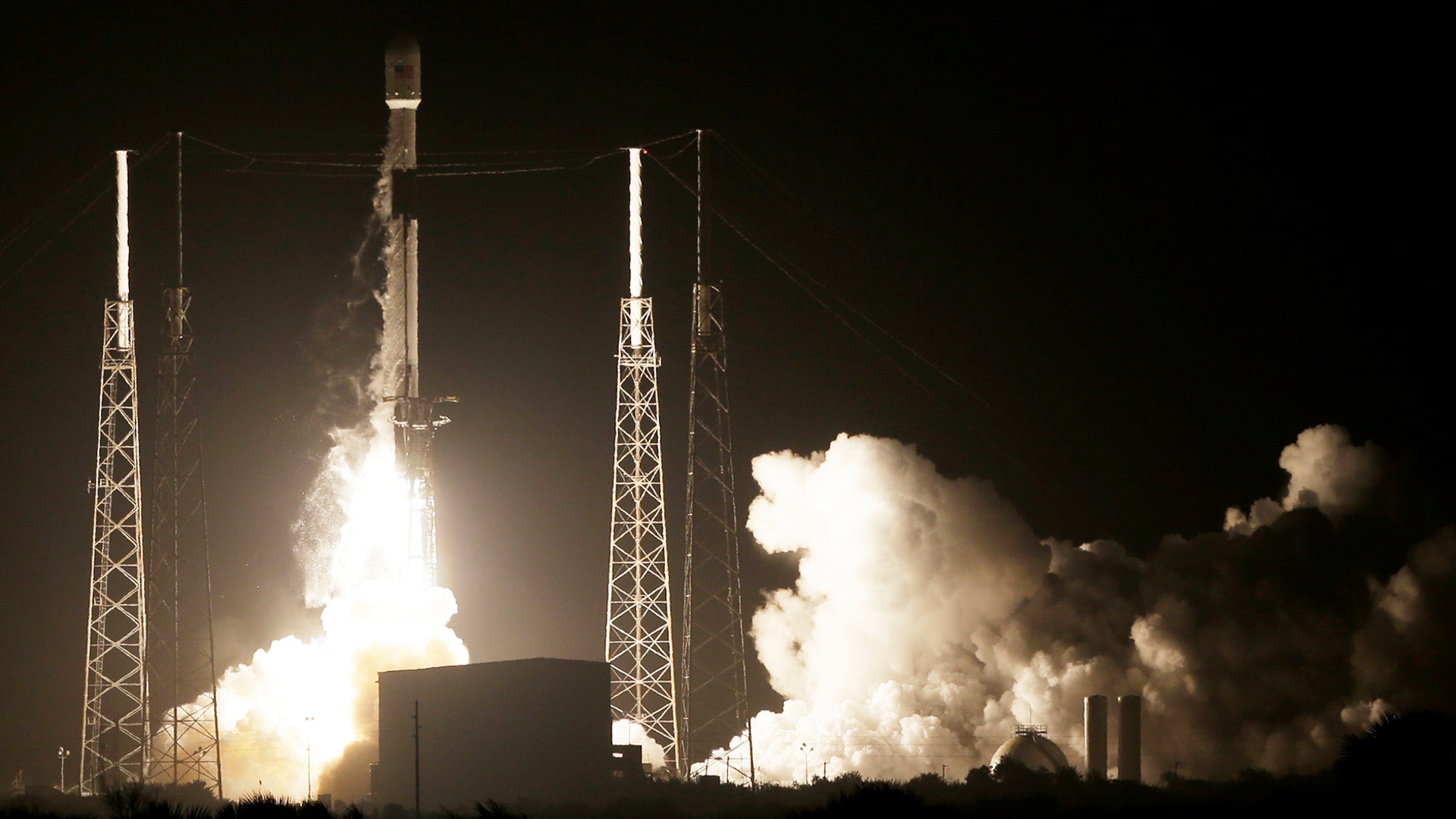 A SpaceX Falcon 9 rocket lifts off with Israel's Lunar Lander and an Indonesian communications satellite at space launch complex 40 in Cape Canaveral, Fla., Feb. 21, 2019. 