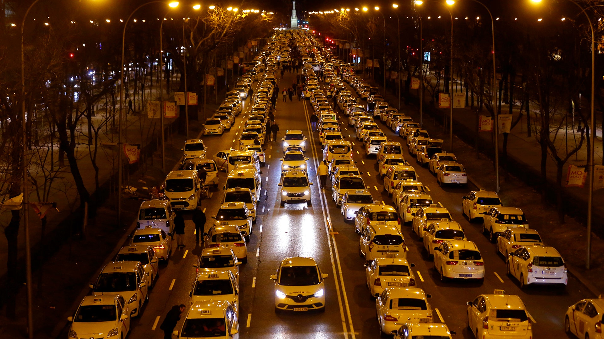 Spanish taxis block the Castellana Avenue, during a strike in Madrid, Spain, Monday, Jan. 28, 2019. 