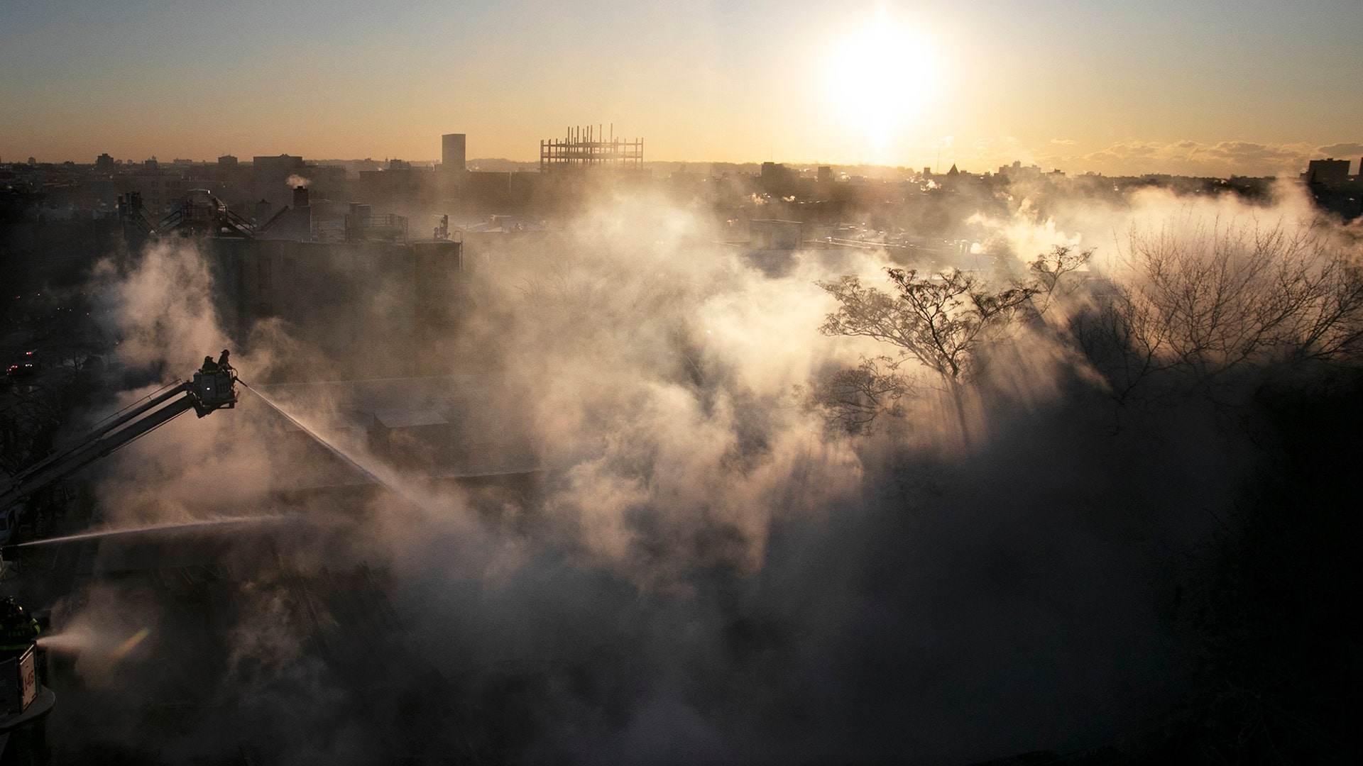Firefighters battle a blaze in a commercial building in the Bedford Stuyvesant neighborhood of Brooklyn, New York City, January 31, 2019.