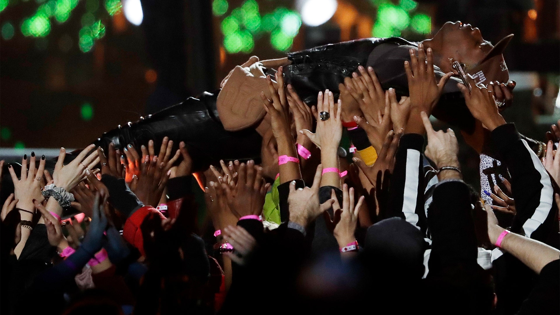 Travis Scott is carried by the crowd during the halftime show at the Super Bowl in Atlanta, February 3. 2019.