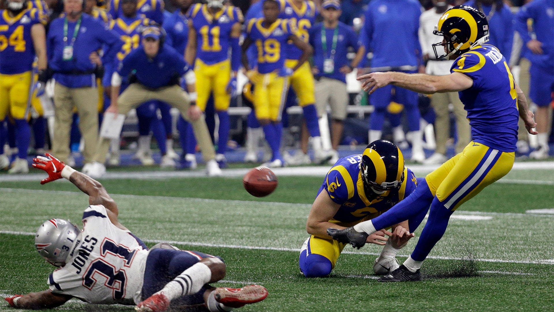 Los Angeles Rams Greg Zuerlein kicks a field goal as Johnny Hekker holds during the second half of the Super Bowl in Atlanta, February 3. 2019.