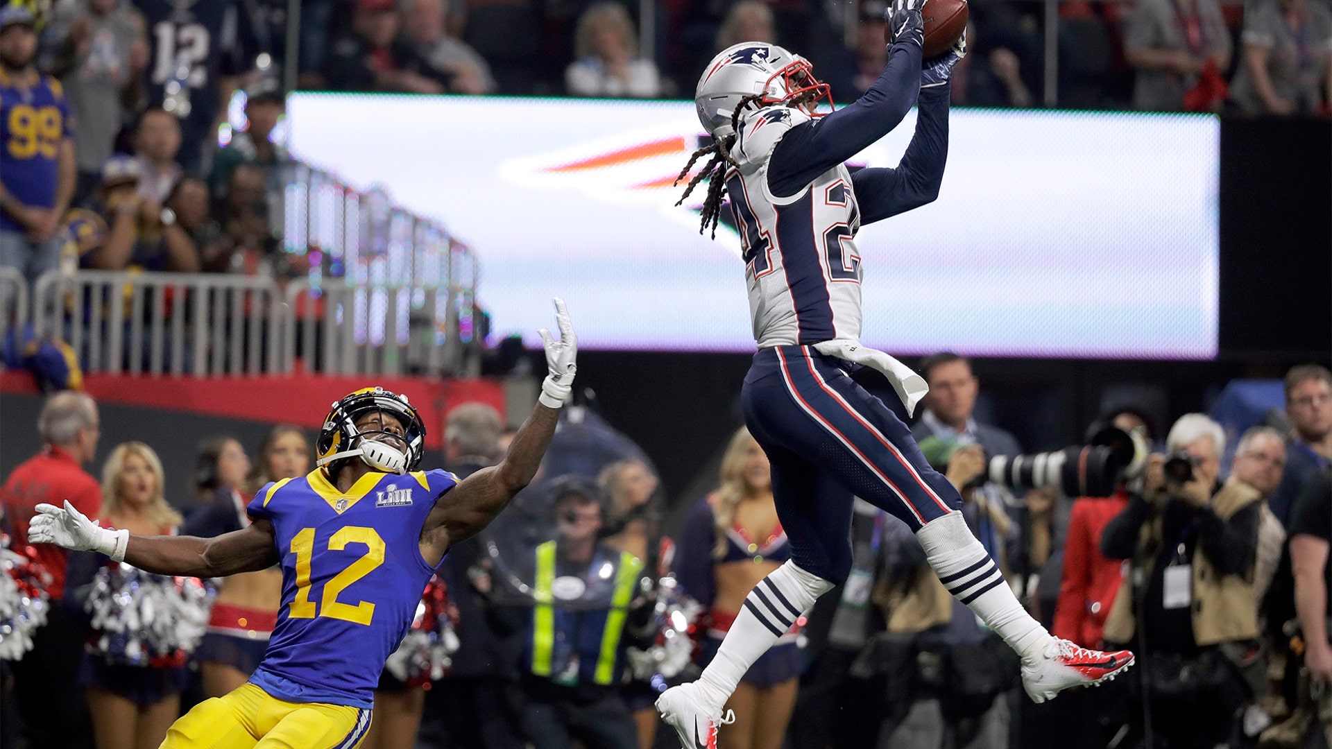 New England Patriots Stephon Gilmore intercepts a pass intended for Los Angeles Rams' Brandin Cooks during the second half of the Super Bowl in Atlanta, February 3. 2019.