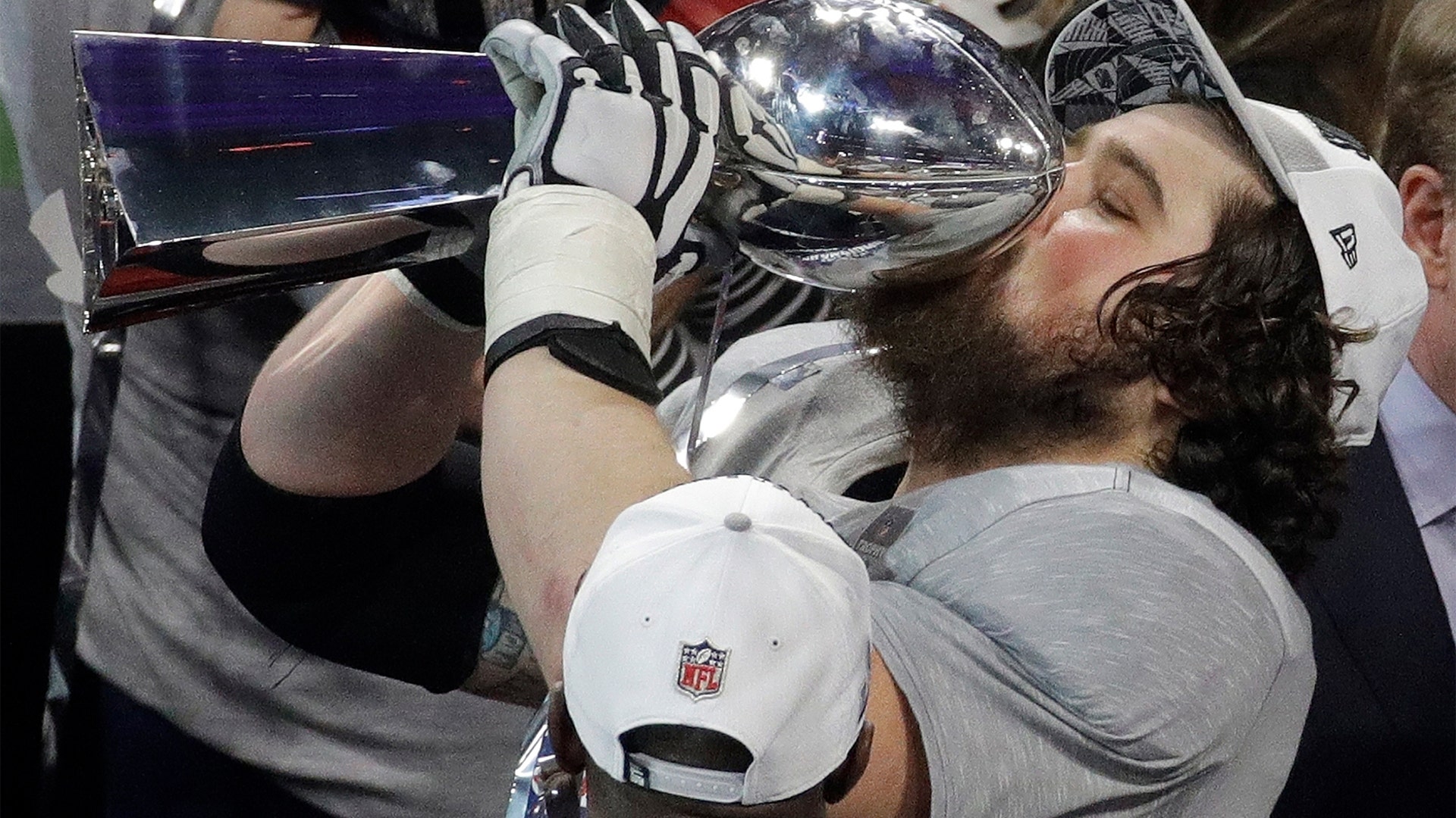 New England Patriots David Andrews kisses the Vince Lombardi Trophy after winning the Super Bowl against the Los Angeles Rams in Atlanta, February 3. 2019.
