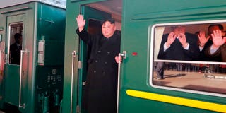 In this Saturday, Feb. 23, 2019, photo provided on Sunday, Feb. 24, 2019, by the North Korean government, North Korean leader Kim Jong Un waves from a train before leaving Pyongyang Station, North Korea, for Vietnam. Kim was on a train Sunday to Vietnam for his second summit with U.S. President Donald Trump, state media confirmed. Independent journalists were not given access to cover the event depicted in this image distributed by the North Korean government. The content of this image is as provided and cannot be independently verified. Korean language watermark on image as provided by source reads: "KCNA" which is the abbreviation for Korean Central News Agency. (Korean Central News Agency/Korea News Service via AP)