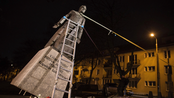 Poland: Statue of priest toppled over abuse claims restored