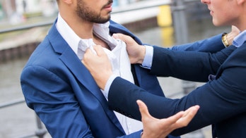 Groom choke-slams bride's 'ex-boyfriend' through a table at wedding reception
