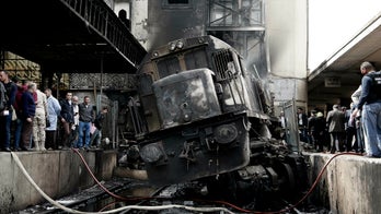 Dozens killed in fire at Cairo train station triggered by two conductors fighting