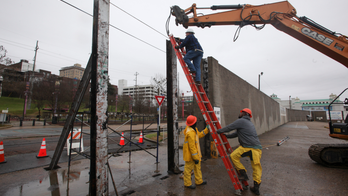 Rivers rise in soggy South as days of rain flood roads