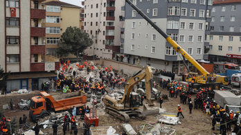 The Latest: Turkey's president visits building collapse site