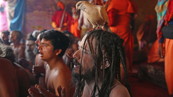 AP Photos: Naked pot-smoking sect grows at Indian Hindu fest