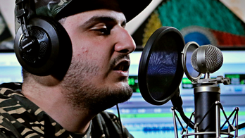 Iraqi rapper gives angry youth in city of Basra music outlet