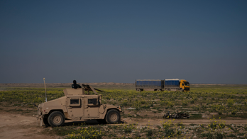 The Latest: Back-to-back suicide car bombs kill 14 in Syria