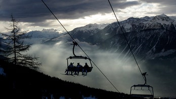At least a dozen people may be buried after avalanche at popular Swiss resort