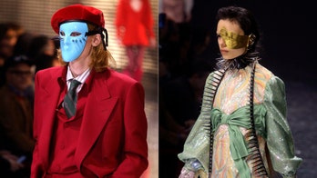 Gucci's dresses models in creepy masks at Milan fashion show