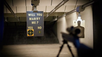 Hunting enthusiast proposes to girlfriend with custom target at shooting range