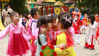 Hanoi Postcard: Children hope to give Kim comradely welcome