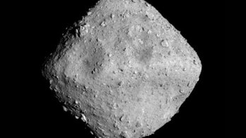 Spacecraft that successfully 'bombed' an asteroid is close to home with valuable cargo