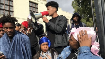 Students stage walkout to protest school’s dress code ban on do-rags