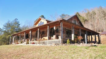 Log cabin-style Kentucky home, made with hand-hewn reclaimed wood, selling for $250G