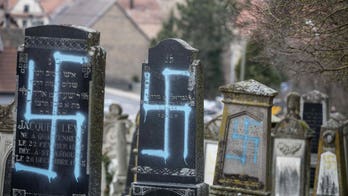 Jewish graves desecrated in France as people hit streets to combat 'poison' of anti-Semitism