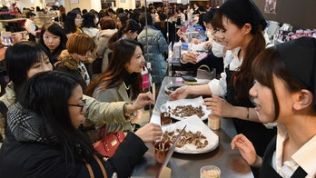 Japanese women rebel against Valentine's tradition of giving male colleagues 'obligation chocolate'