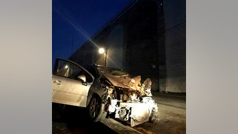 Suspected drunk driver survives 50-foot plunge off wall