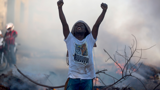 Protesters stone home of Haiti president, clash with police