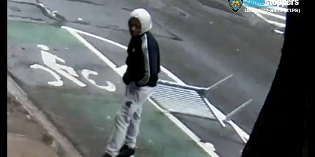 New York City police were looking for a man who allegedly attacked a woman with a metal barrier.