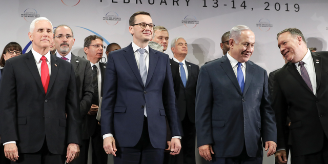 FILE - In this Thursday, Feb. 14, 2019 file photo, United States Vice President Mike Pence, Prime Minister of Poland Mateusz Morawiecki, Israeli Prime Minister Benjamin Netanyahu and United State Secretary of State Mike Pompeo, from left, stand on a podium at a conference on Peace and Security in the Middle East in Warsaw, Poland. A two-day security conference in Warsaw was supposed to be a crowning achievement for Israeli Prime Minister Benjamin Netanyahu, stamping a seal on his long-held goal of pushing his behind-the-scenes ties with Arab leaders into the open. Instead, the publicity-seeking Israeli leader made one embarrassing misstep after another, distracting attention from his main mission and sending his aides into a nonstop cycle of damage control. (AP Photo/Michael Sohn, File)