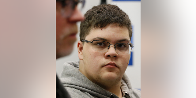 FILE - In this March 6, 2017, file photo, Gloucester County High School senior Gavin Grimm, a transgender student, listens to a speaker during a news conference in Richmond, Va. Grimm is continuing to sue the Gloucester County School Board in Virginia over a policy that banned him from using the boys' bathrooms. He's now trying to amend the suit to include the matter of his unchanged transcripts. (AP Photo/Steve Helber, File)