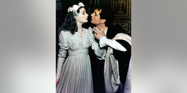 Vivien Leigh prepares to kiss Laurence Olivier in a scene from a stage production of "Romeo and Juliet," 1940.