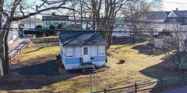 A tiny New Hampshire cottage sitting on less than half an acre of land is on the market for $2 million.