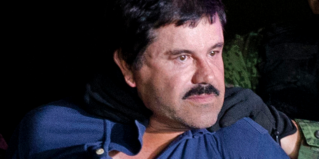 Joaquin "El Chapo" Guzman is made to face the media in Mexico City as he is escorted by Mexican soldiers following his recapture six months after escaping from a maximum security prison. The notorious Mexican drug lord was convicted of drug-trafficking charges, Tuesday, Feb. 12 2019, in federal court in New York. (AP Photo/Eduardo Verdugo, File)