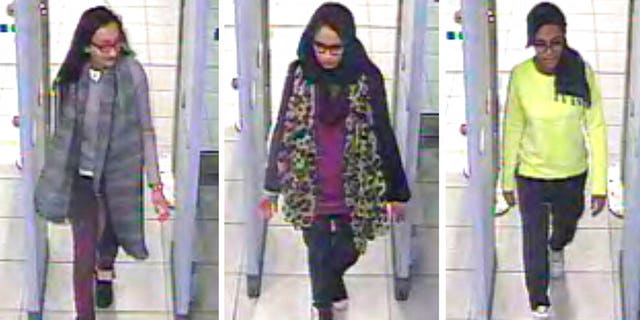 FILE - This Monday Feb. 23, 2015 file handout image of a three image combo of stills taken from CCTV issued by the Metropolitan Police shows Kadiza Sultana, left, Shamima Begum, center, and Amira Abase going through security at Gatwick airport, south England, before catching their flight to Turkey. Shamima Begum told The Times newspaper in a story published Thursday Feb. 14, 2019, that she wants to come back to London.