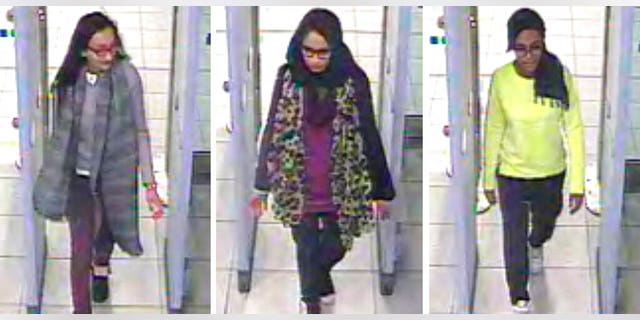 FILE - This Monday Feb. 23, 2015 file handout image of a three image combo of stills taken from CCTV issued by the Metropolitan Police shows Kadiza Sultana, left, Shamima Begum, center, and Amira Abase going through security at Gatwick airport, south England, before catching their flight to Turkey. Shamima Begum told The Times newspaper in a story published Thursday Feb. 14, 2019, that she wants to come back to London.