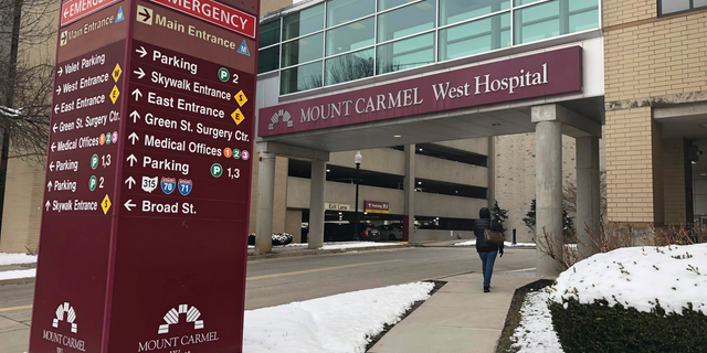 FILE - In this Jan. 15, 2019 file photo, the main entrance to Mount Carmel West Hospital is shown in Columbus, Ohio. The Ohio hospital system investigating a doctor accused of ordering painkiller overdoses for dozens of patients says five who died may have received excessive doses when there still was a chance to improve their conditions with treatment. The Columbus-area Mount Carmel Health System said Friday, Feb. 22 it's notifying those patients' families. (AP Photo/Andrew Welsh Huggins, File)