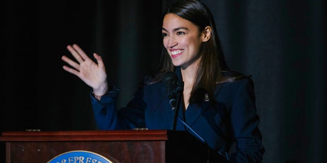 Rep. Alexandria Ocasio-Cortez, D-N.Y., delivers her inaugural address following her swearing-in ceremony at the Renaissance School for Musical Theater and Technology in the Bronx borough of New York on Saturday, Feb. 16, 2019. (AP Photo/Kevin Hagen)