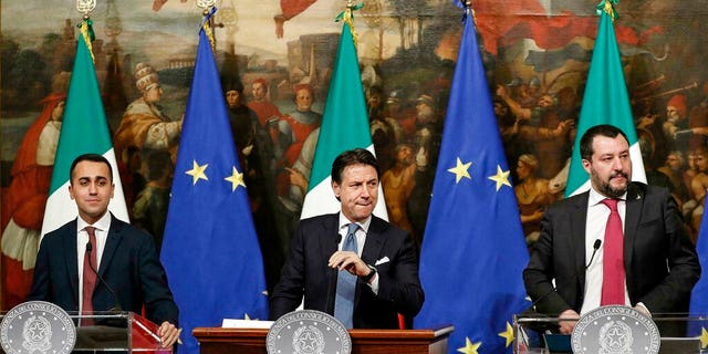 Italian Premier Giuseppe Conte, center, Deputy Premier and Labour and Industry Minister Luigi Di Maio, left, and Deputy Premier and Interior Minister, Matteo Salvini, attend a press conference following a Cabinet meeting at Chigi Palace's premier office in Rome, Thursday, Jan. 17, 2019.