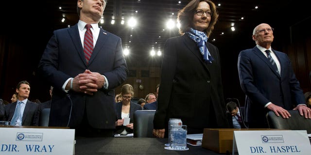 From left, FBI Director Christopher Wray, CIA Director Gina Haspel and Director of National Intelligence Daniel Coats arrive to testify before the Senate Intelligence Committee on Capitol Hill in Washington Tuesday, Jan. 29, 2019. (AP Photo/Jose Luis Magana)