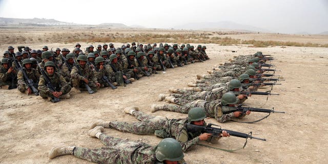 Afghan National Army soldiers perform a live firing exercise at the Afghan Military Academy in Kabul, Afghanistan, on Oct. 31, 2018. (AP Photo/Rahmat Gul, File)