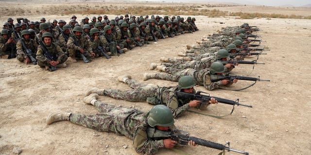 Afghan National Army soldiers perform a live firing exercise at the Afghan Military Academy in Kabul, Afghanistan, on Oct. 31, 2018. (AP Photo/Rahmat Gul, File)