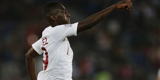 Qatar's forward Almoez Ali celebrates ahet he scored first goal during the AFC Asian Cup final match between Japan and Qatar in Zayed Sport City in Abu Dhabi, United Arab Emirates, Friday, Feb. 1, 2019. (AP Photo/Kamran Jebreili)
