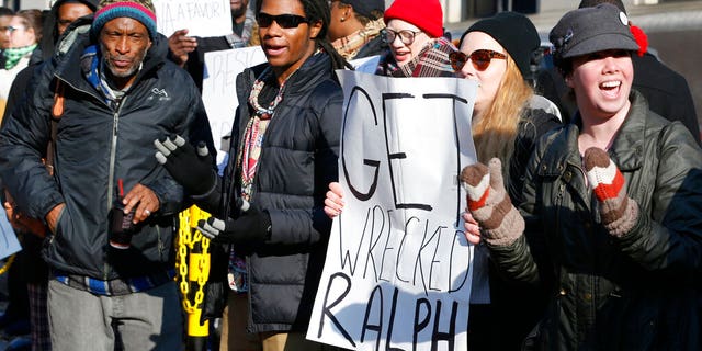 Demonstrators at the Capitol in Richmond, Va., this past Saturday. (AP Photo/Steve Helber)