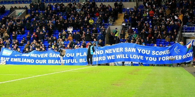 Tributes are paid to Emiliano Sala ahead of the English Premier League soccer match between Cardiff and Bournemouth at the Cardiff City Stadium, in Cardiff, Wales, Saturday, Feb. 2, 2019. (Mark Kerton/PA via AP)