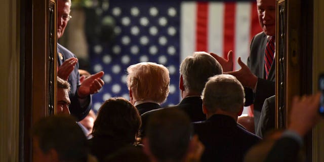   FILE- In this photo of January 30, 2018, President Donald Trump appears in front of the House while he arrives for his home country. the speech of the Union at a joint session of Congress on Capitol Hill in Washington. The State of the Union speech puts the president, his cabinet, members of Congress, military leaders, senior diplomats and Supreme Court justices in the same place and at the same time, in the eyes of the whole world. Protecting everyone requires months of planning and coordination involving several law enforcement agencies led by the US secret service. (AP Photo / Susan Walsh, record) 