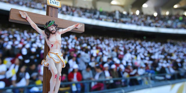 Worshippers attend Pope Francis Mass at the Sheikh Zayed Sports City in Abu Dhabi, United Arab Emirates.