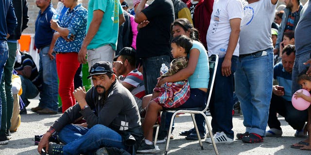 Immigrants from Central America are lining up to register with Mexican immigration authorities in a shelter in Piedras Negras, Mexico, on Tuesday, February 5, 2019. A caravan of about 1,600 Central American migrants camped Tuesday in the Mexican border town of Piedras Negras, just in Eagle Pass, Texas. The governor of Coahuila State in the north of the country described the migrants as "asylum seekers", suggesting that all had the express intention of surrendering to US authorities. (Jerry Lara / The San Antonio Express-News via AP)