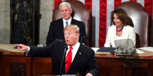 President Donald Trump acknowledges women in Congress as he delivers his State of the Union address to a joint session of Congress on Capitol Hill in Washington, as Vice President Mike Pence and Speaker of the House Nancy Pelosi, D-Calif., watch, Tuesday, Feb. 5, 2019. (AP Photo/Andrew Harnik)