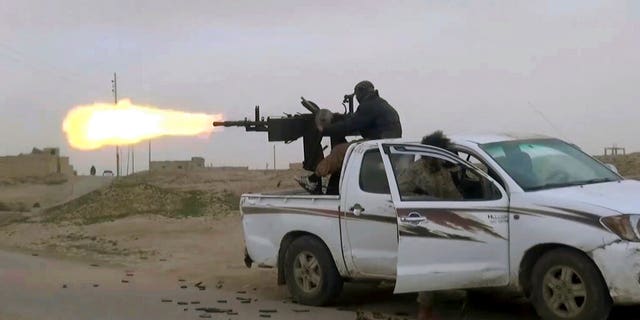 This video frame is recorded online on Friday, January 18, 2019, by the support of the Islamic State group, which is seen on the movement of a group of Islamic States group gun by members of the Syrian Democratic Forces supported by the States United, in the eastern province of Syria says el-Zour, Syria.