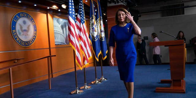 Speaker Nancy Pelosi, D-Calif., departs after talking with reporters during her weekly news conference on Capitol Hill on Feb. 7. (AP Photo/J. Scott Applewhite)